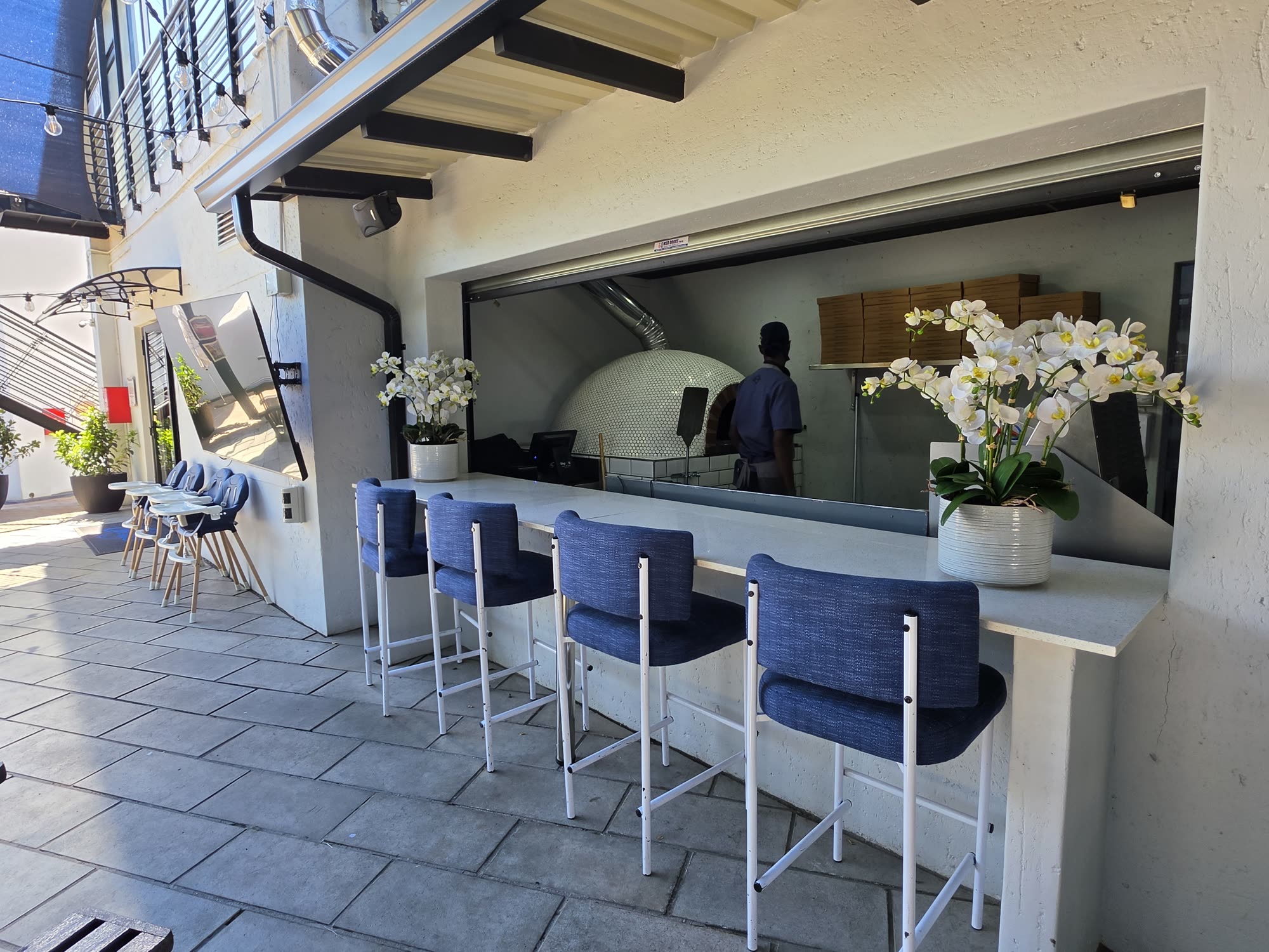 Counter seats at the pizza oven
